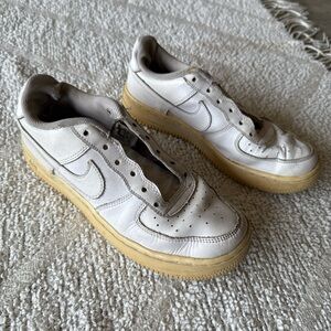 White Nike Sneakers with Yellowed Soles